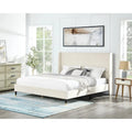 Lit plateforme style queen-size beige avec tête de lit en velours à oreilles